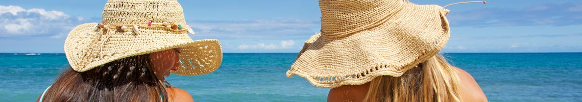 Two women in the sun with shadehats