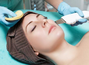 cosmetic dermatology being performed on a woman's face