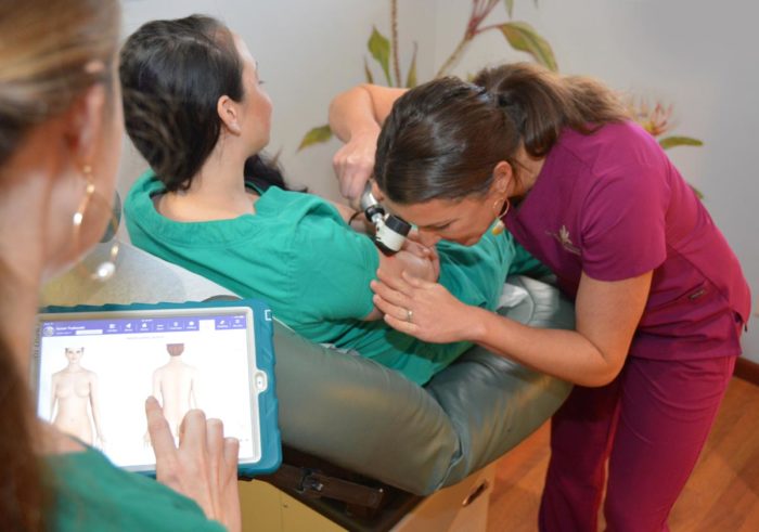 Nurses performing a dermascope check up