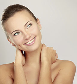 Cosmetic Dermatology, woman smiling with hands behind neck