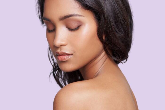 Patient receiving SkinDNA for personalized skincare consultation at Dr. Monica Scheel’s clinic